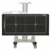 Horizontal mobile X-ray panel holder with alignment markers, mounted on a central support column with four caster wheels.