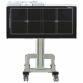 Horizontal mobile X-ray panel holder with alignment markers, mounted on a central support column with four caster wheels.