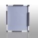 Square gray panel with white frame and dark protective pads on all sides, placed on a reflective surface.
