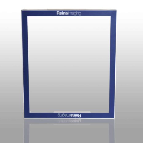 1120327-scaled Blue rectangular frame with white inner edges and “Reina Imaging” text at the top and bottom, placed on a reflective surface.