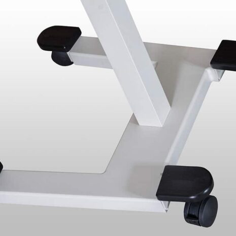12 Close-up of wheeled base of a mobile equipment stand with four caster wheels.