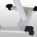 Close-up of wheeled base of a mobile equipment stand with four caster wheels.