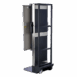 Angled view of a mobile X-ray cassette holder with black panel, metal frame, and wheels.