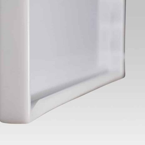 3 Close-up angled view of the bottom edge of a white frame with a recessed groove and smooth finish.