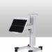Mobile equipment stand with vertical column, wheeled base, and flat adjustable panel mounted at an angle