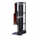 Side view of a vertical X-ray film holder with metal frame, side handle, and mounted cassette, featuring a foot platform and wheels for mobility.