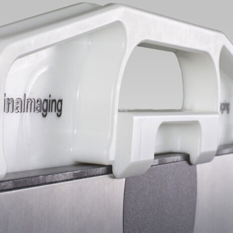 4-8 Close-up of a white frame with a built-in top handle attached to a gray imaging panel.