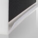 Close-up of a white frame corner with an integrated bottom handle attached to a carbon-fiber imaging panel.