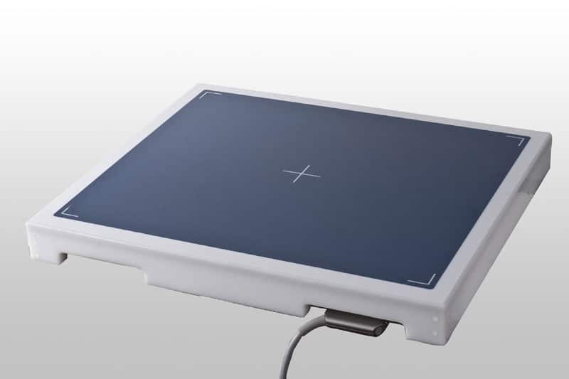 Flat rectangular panel with a dark blue surface, white edges, and a centered crosshair, featuring a connected cable.