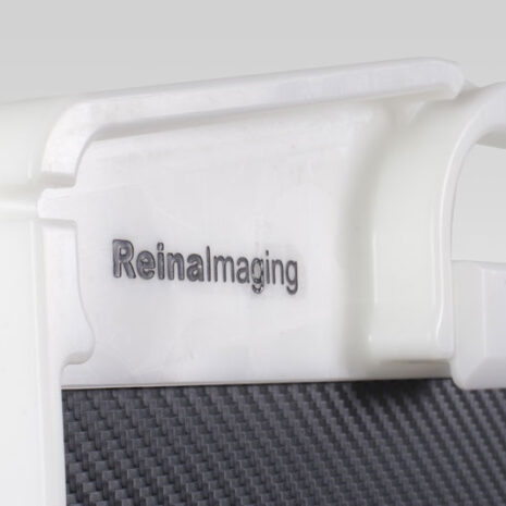 6-6 Close-up of a white frame with integrated handle and “Reina Imaging” branding above a black textured panel.