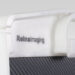 Close-up of a white frame with integrated handle and “Reina Imaging” branding above a black textured panel.