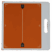 Orange X-ray grid with alignment markers and a white handle on the side.