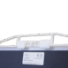 Close-up of a white locking handle on a carbon fiber X-ray grid with a PAG label and specifications