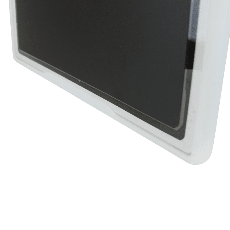 Close-up of a black flat panel detector partially enclosed in a white protective holder