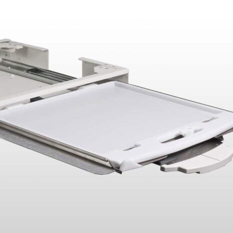 BI-ACTION Flat panel detector in white protective case inserted into a sliding tray of a medical imaging system