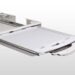 Flat panel detector in white protective case inserted into a sliding tray of a medical imaging system