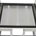 Top view of a white metal frame with a black border and glass panel insert.
