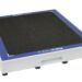 Angled view of a white rectangular panel with a black textured surface, blue border, and a handle cutout on the side