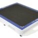 Angled view of a white rectangular panel with a black textured surface, blue border, and a handle cutout on the side