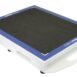 Angled view of a white rectangular panel with a black textured surface, blue border, and a handle cutout on the side