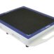 Angled view of a white rectangular panel with a black textured surface, blue border, and a handle cutout on the side