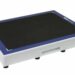 Angled view of a white rectangular panel with a black textured surface, blue border, and a handle cutout on the side