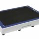 Angled view of a white rectangular panel with a black textured surface, blue border, and a handle cutout on the side