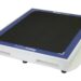 Angled view of a white rectangular panel with a black textured surface, blue border, and a handle cutout on the side