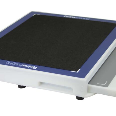 ET1417_TOP_HERO1 Angled view of a white rectangular panel with a black textured surface, blue border, and a handle cutout on the side