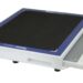 Angled view of a white rectangular panel with a black textured surface, blue border, and a handle cutout on the side