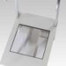 Top view of a white metal frame with two vertical handles and a square cutout in the center
