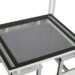 Top view of a white metal frame with a black border and glass panel insert.
