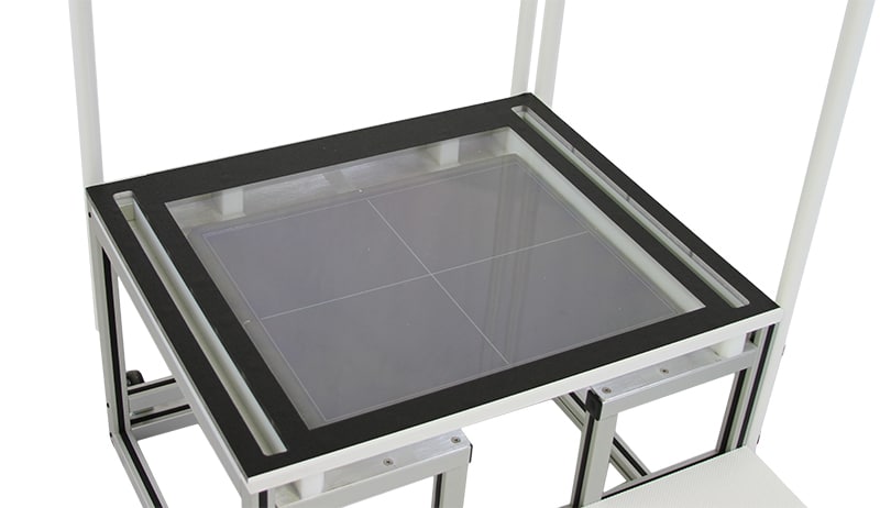 Overhead-with-DR Top view of a white metal frame with a black border and glass panel insert.