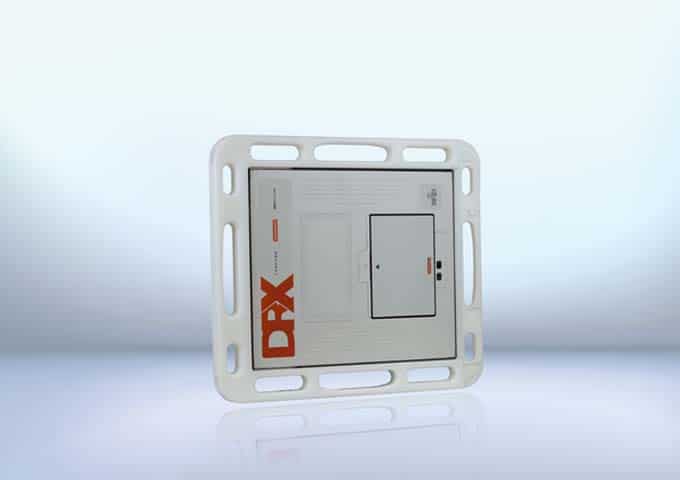 Rectangular grid with rounded corners, labeled 'DRX', featuring slots, graphics, and a black-outlined section