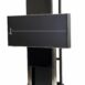Angled view of a wall-mounted X-ray film holder with black horizontal panel, white alignment line, and metal frame featuring adjustment holes and foot platform