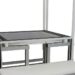 Metal frame structure with a white bench and integrated slots for components