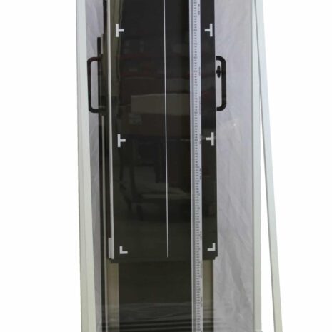 easy-reader_ERSPH-scaled Tall imaging panel mounted vertically in a white metal stand with caution labels and a ruler for positioning.
