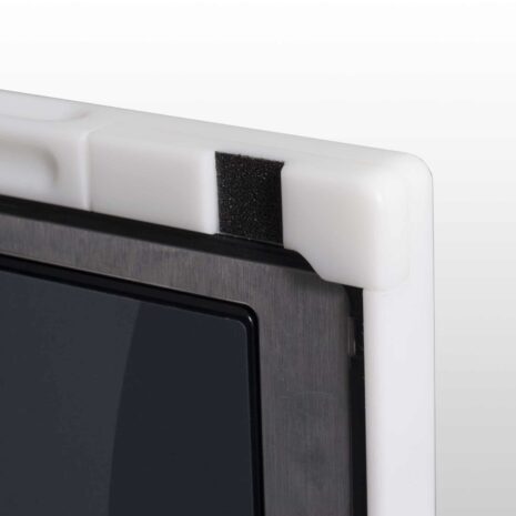 ps14-action-2-Copy-scaled Close-up of a white corner protector with black foam padding on a carbon fiber X-ray grid frame