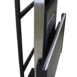 Angled view of a metallic stand with a black frame and a mounted panel, showing layered components and a slim rectangular support structure.