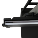 Close-up of a black metal bracket with a mounted glass or acrylic panel edge.