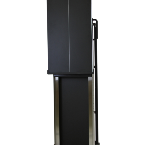 tm80i_hero3 Tall black rectangular panel with a vertical center line and side handles, mounted on a metallic frame with a flat base, shown at a slight angle.